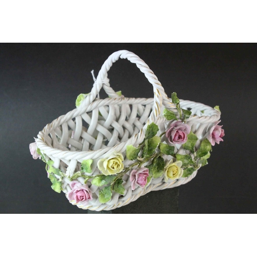 15 - German Von Schierholz Porcelain Pierced Basket decorated with encrusted flowers, 21cms long