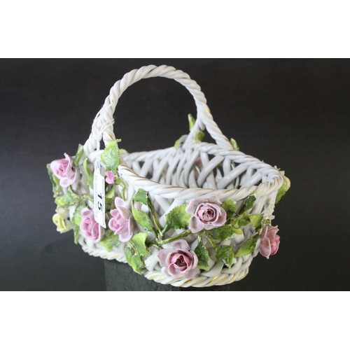 15 - German Von Schierholz Porcelain Pierced Basket decorated with encrusted flowers, 21cms long