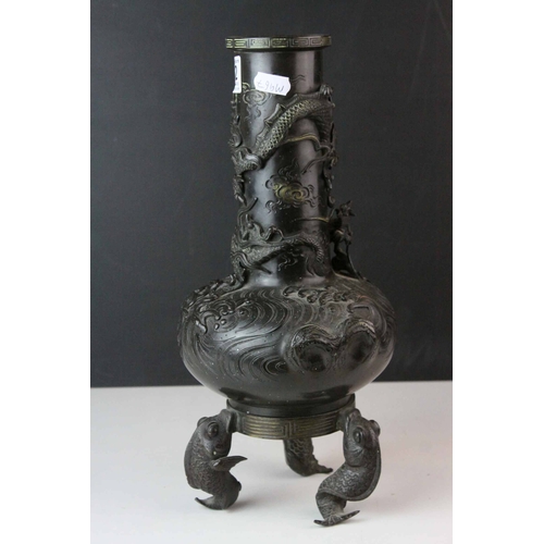 152 - Japanese Bronze, the body cast in relief with three clawed dragon and raised on three koi carp suppo... 