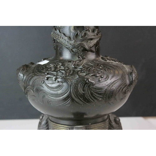 152 - Japanese Bronze, the body cast in relief with three clawed dragon and raised on three koi carp suppo... 