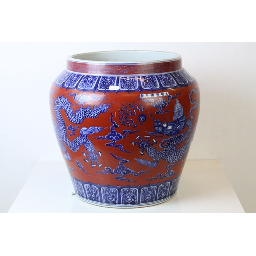 158 - Large Chinese Ceramic Jardiniere decorated with Five Toed Dragons on a Red Ground, 39cms high