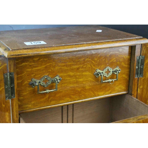 159 - Late 19th century Oak Table Top Cabinet, the two glazed doors opening to reveal drawers with brass h... 