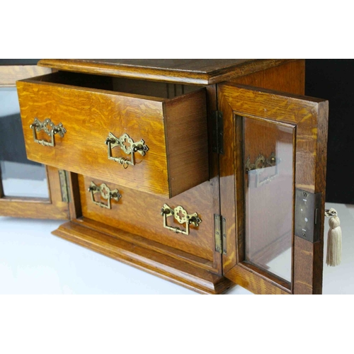 159 - Late 19th century Oak Table Top Cabinet, the two glazed doors opening to reveal drawers with brass h... 