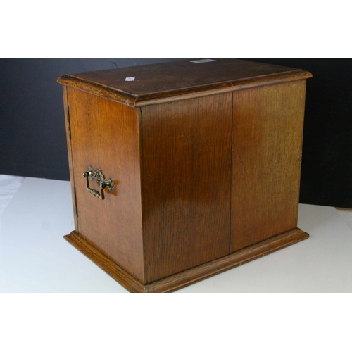 159 - Late 19th century Oak Table Top Cabinet, the two glazed doors opening to reveal drawers with brass h... 