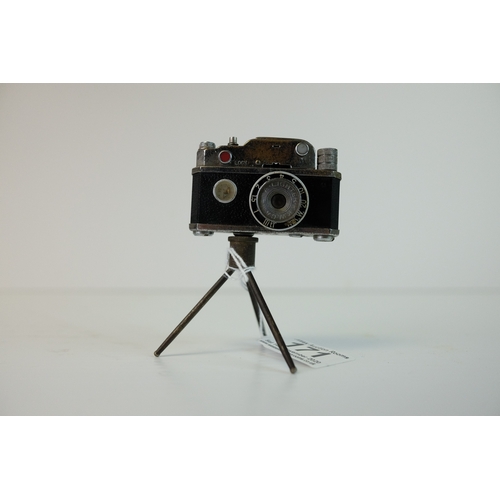 171 - Early 20th century Novelty Table Lighter in the form of a Camera stood on a Tripod Base, 9.5cms high