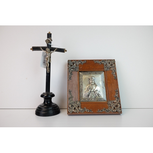 175 - Wooden Ebonised Crucifix mounted with a White Metal Christ and raised on a plinth base, 19.5cms high... 