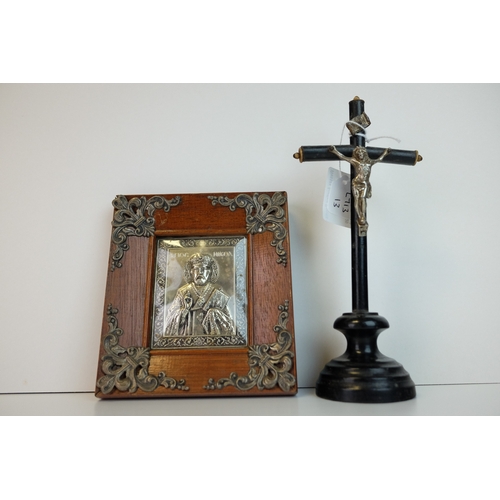 175 - Wooden Ebonised Crucifix mounted with a White Metal Christ and raised on a plinth base, 19.5cms high... 