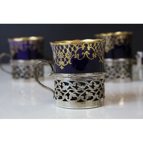 178 - Four Aynsley Cabinet Coffee Cans with Saucers, cobalt blue with gilt highlights, all the cans held w... 