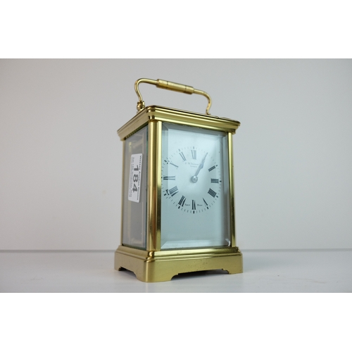 184 - Late 19th / Early 20th century Gilt Brass Carriage Clock, the white enamel face with Roman numerals ... 