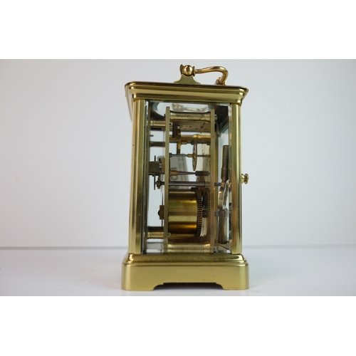 184 - Late 19th / Early 20th century Gilt Brass Carriage Clock, the white enamel face with Roman numerals ... 