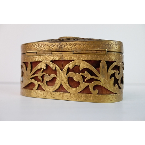 187 - Late 19th / Early 20th century Oval Pierced Gilt Metal Trinket / Jewellery Box, the hinged lid inset... 