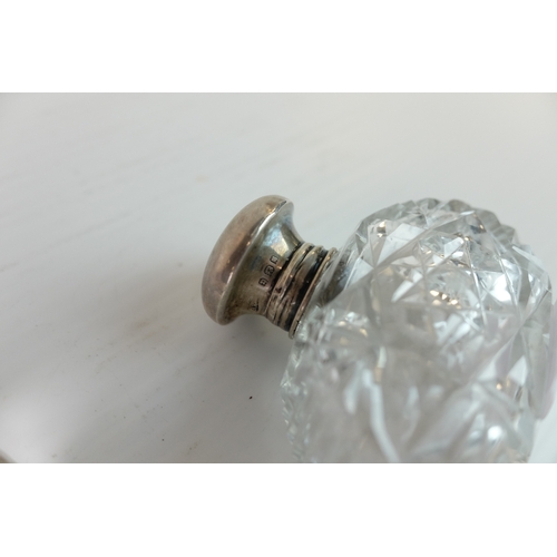 195 - Two Early 20th century Silver Collared and Glass Perfume Bottles together with Two Dressing Jars... 