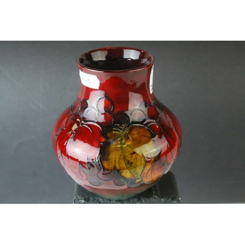 23 - Moorcroft Flambe Leaf and Berry Pattern Vase, 13cms high