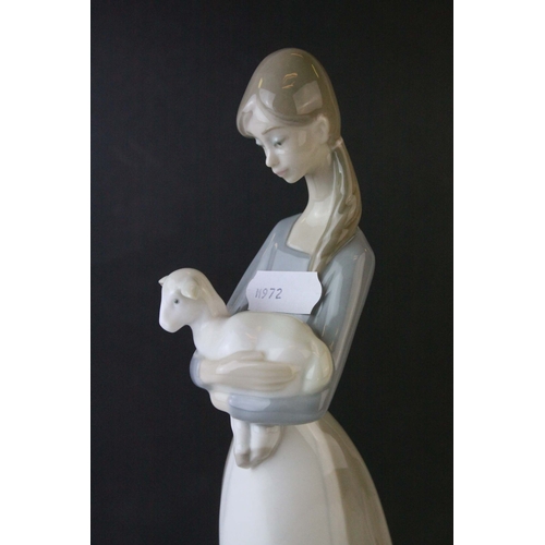 30 - Lladro Figure of a Girl holding a Kid Goat, 27cms high together with a Lladro Model of Polar Bears '... 