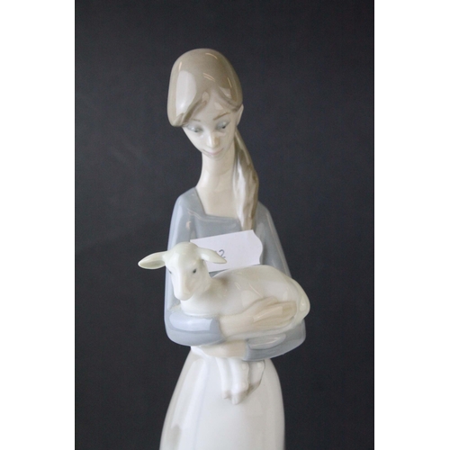 30 - Lladro Figure of a Girl holding a Kid Goat, 27cms high together with a Lladro Model of Polar Bears '... 