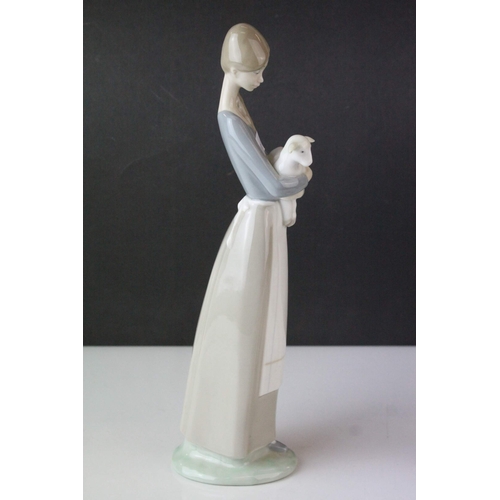 30 - Lladro Figure of a Girl holding a Kid Goat, 27cms high together with a Lladro Model of Polar Bears '... 