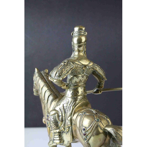 42 - Brass Model of a Chinese Guandi Warrior on Horseback with applied cabochon stones, 23cms high