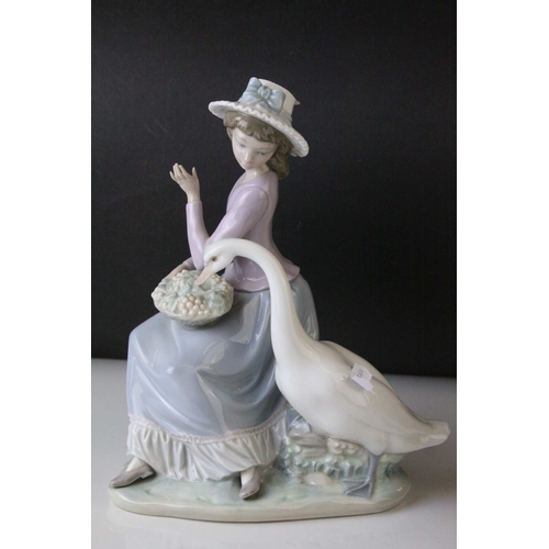 6 - Two Lladro Figures, Caress and Rest, model no. 1245, 21cms high and a Seated Girl holding Flower Bas... 