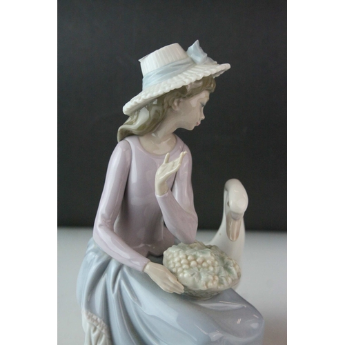 6 - Two Lladro Figures, Caress and Rest, model no. 1245, 21cms high and a Seated Girl holding Flower Bas... 