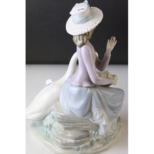 6 - Two Lladro Figures, Caress and Rest, model no. 1245, 21cms high and a Seated Girl holding Flower Bas... 