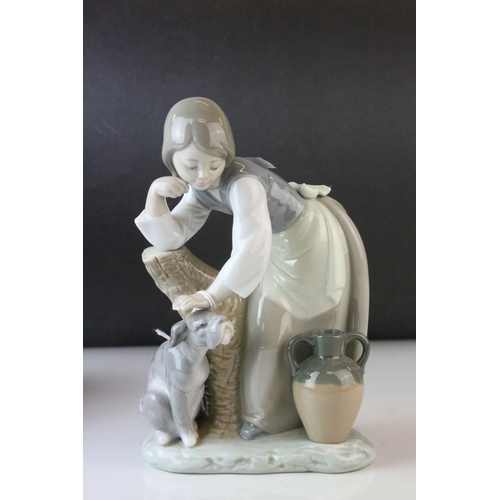 6 - Two Lladro Figures, Caress and Rest, model no. 1245, 21cms high and a Seated Girl holding Flower Bas... 