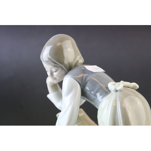 6 - Two Lladro Figures, Caress and Rest, model no. 1245, 21cms high and a Seated Girl holding Flower Bas... 