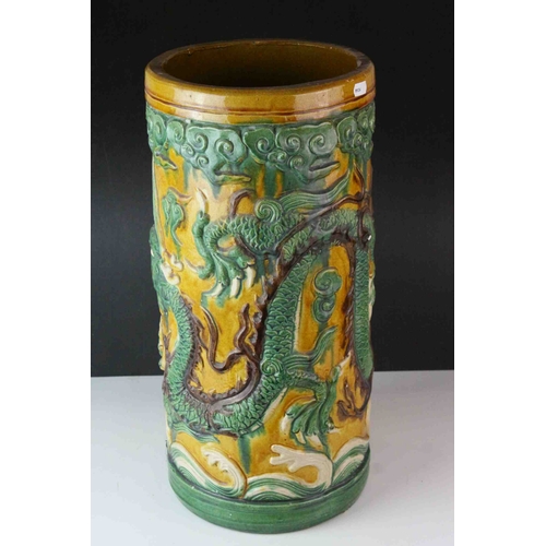 65 - 20th century Chinese Sancai Pottery Stickstand decorated with a Dragon, 48cms high