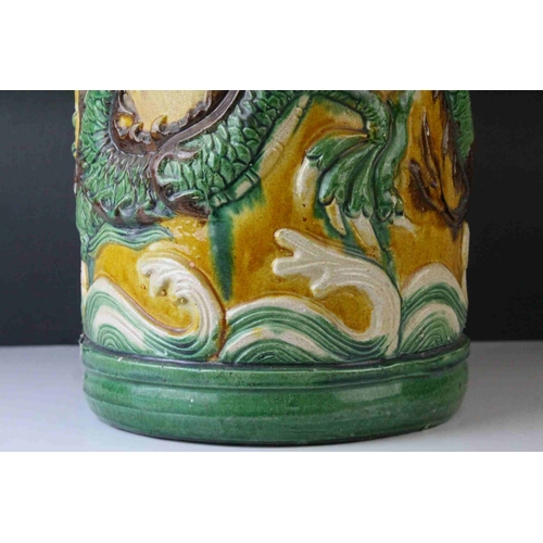 65 - 20th century Chinese Sancai Pottery Stickstand decorated with a Dragon, 48cms high