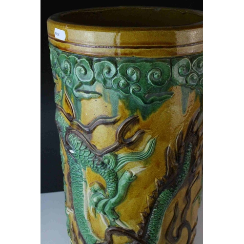 65 - 20th century Chinese Sancai Pottery Stickstand decorated with a Dragon, 48cms high