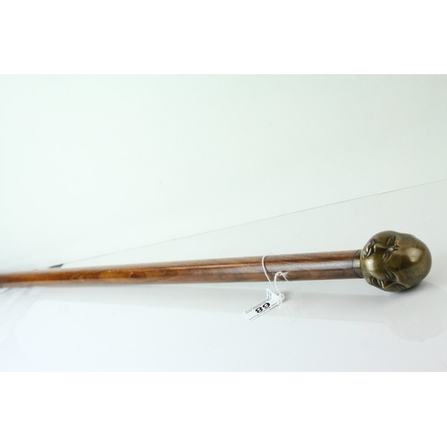 68 - Walking Stick with Bronze Four Head Buddha Knob