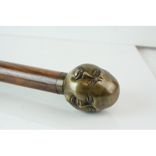 68 - Walking Stick with Bronze Four Head Buddha Knob