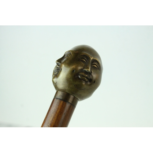 68 - Walking Stick with Bronze Four Head Buddha Knob