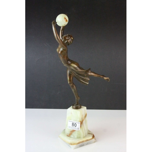 80 - Bronze Effect Art Deco Style Figurine holding an Onyx Ball and stood on an Onyx Plinth, 36cms high