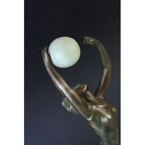 80 - Bronze Effect Art Deco Style Figurine holding an Onyx Ball and stood on an Onyx Plinth, 36cms high