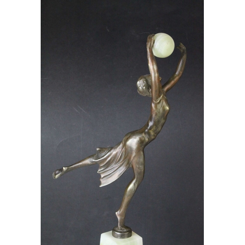 80 - Bronze Effect Art Deco Style Figurine holding an Onyx Ball and stood on an Onyx Plinth, 36cms high