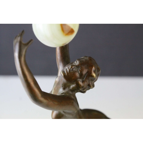 80 - Bronze Effect Art Deco Style Figurine holding an Onyx Ball and stood on an Onyx Plinth, 36cms high