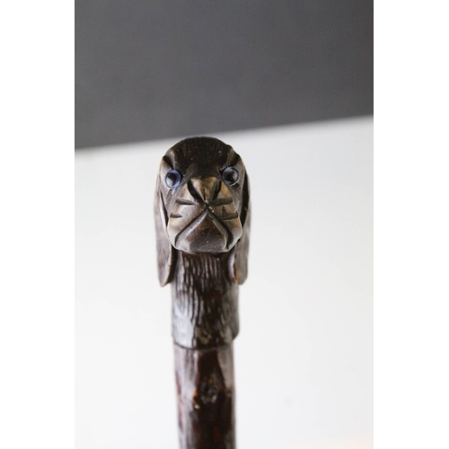 83 - Late 19th / Early 20th century Walking Stick, the wooden handle carved in the form of a Dog