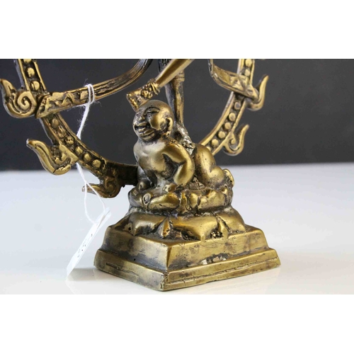 87 - Vintage Brass Statue of an Indian Deity standing on a Buddha's Back