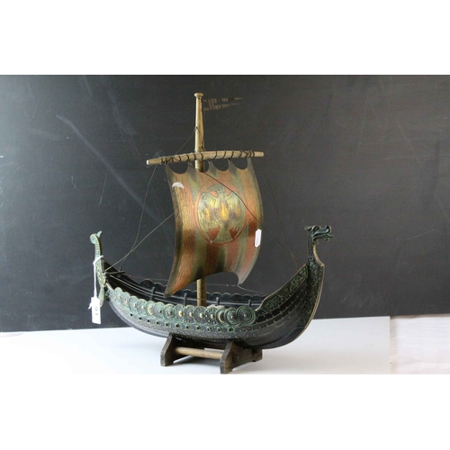 91 - Bronzed Metal Model of a Viking Boat held on a Wooden Stand, 43cms long, with makers mark for E Aaga... 