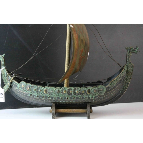 91 - Bronzed Metal Model of a Viking Boat held on a Wooden Stand, 43cms long, with makers mark for E Aaga... 