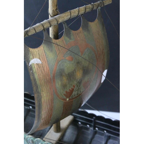 91 - Bronzed Metal Model of a Viking Boat held on a Wooden Stand, 43cms long, with makers mark for E Aaga... 