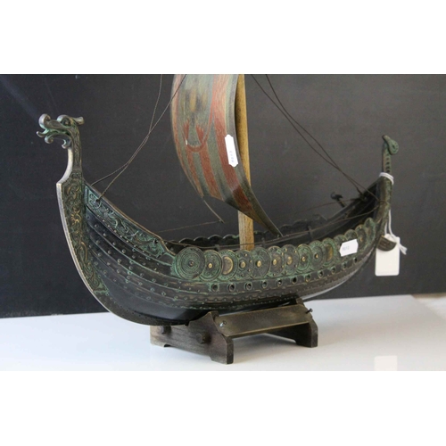 91 - Bronzed Metal Model of a Viking Boat held on a Wooden Stand, 43cms long, with makers mark for E Aaga... 