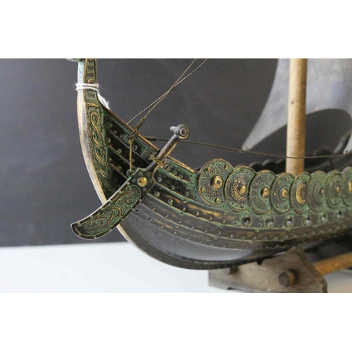 91 - Bronzed Metal Model of a Viking Boat held on a Wooden Stand, 43cms long, with makers mark for E Aaga... 