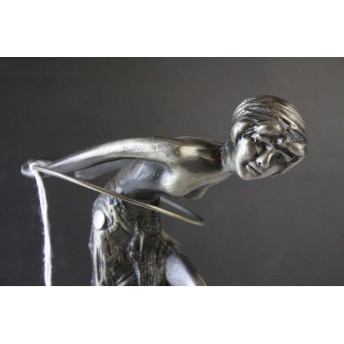 93 - Metal Model of an Art Deco Style Figurine with a Hoop raised on a Marble Plinth, 23cms high