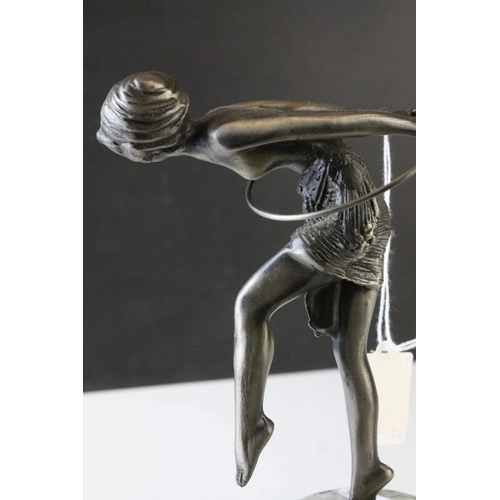 93 - Metal Model of an Art Deco Style Figurine with a Hoop raised on a Marble Plinth, 23cms high