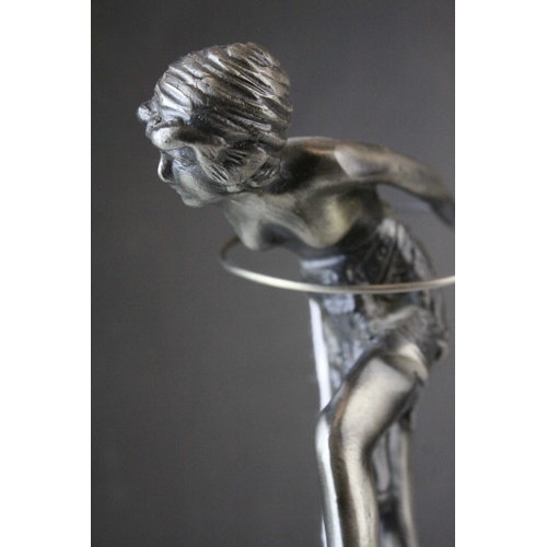 93 - Metal Model of an Art Deco Style Figurine with a Hoop raised on a Marble Plinth, 23cms high