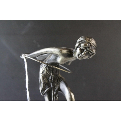 93 - Metal Model of an Art Deco Style Figurine with a Hoop raised on a Marble Plinth, 23cms high