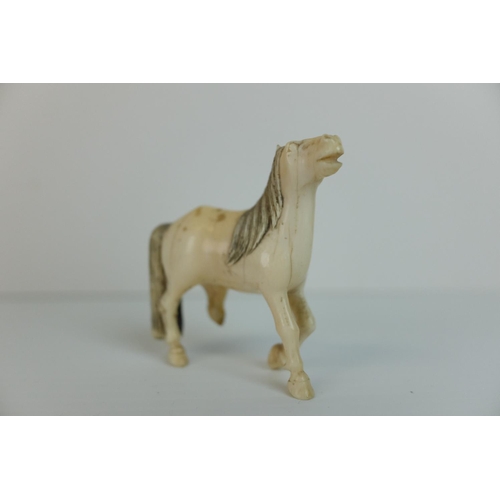 219 - Two Early 20th century Chinese / Japanese Carved Ivory Horses together with Five Jade? / Green Stone... 