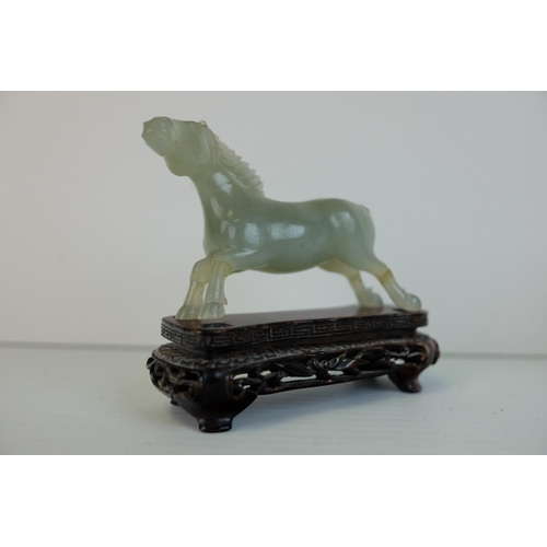 219 - Two Early 20th century Chinese / Japanese Carved Ivory Horses together with Five Jade? / Green Stone... 