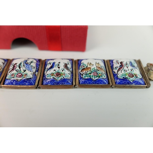 238 - Middle Eastern White Metal Bracelet comprising eight hinged enamelled panels depicting birds, animal... 